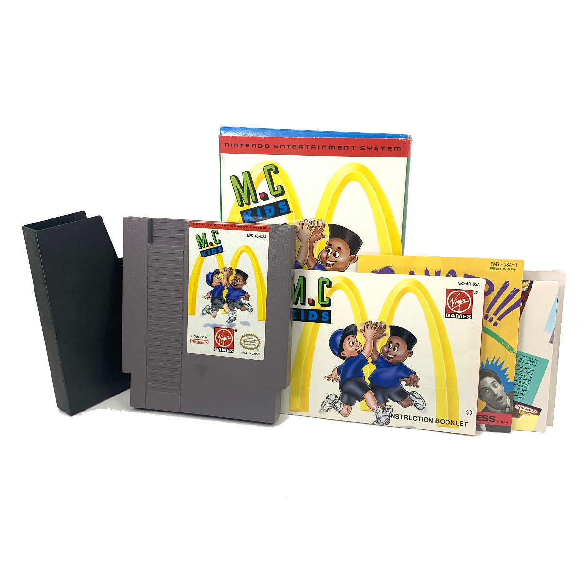 A Nintendo Entertainment System with a game cartridge labeled 'M.C. Kids' and a manual for the game.