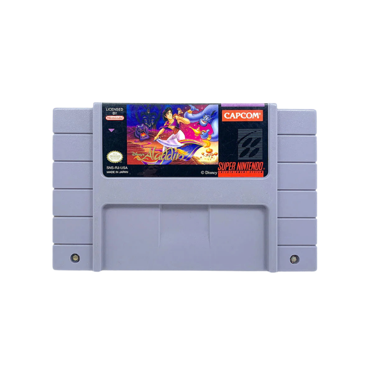A Super Nintendo Entertainment System game cartridge of 'Aladdin' by Capcom.